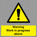 gender-neutral-construction-warning-sign-warning-work-in-progress-above-with-exc~